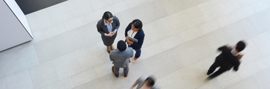 Directly-above -view-of-intercultural-business-colleagues-in -formalwear standing-in-lobby of company